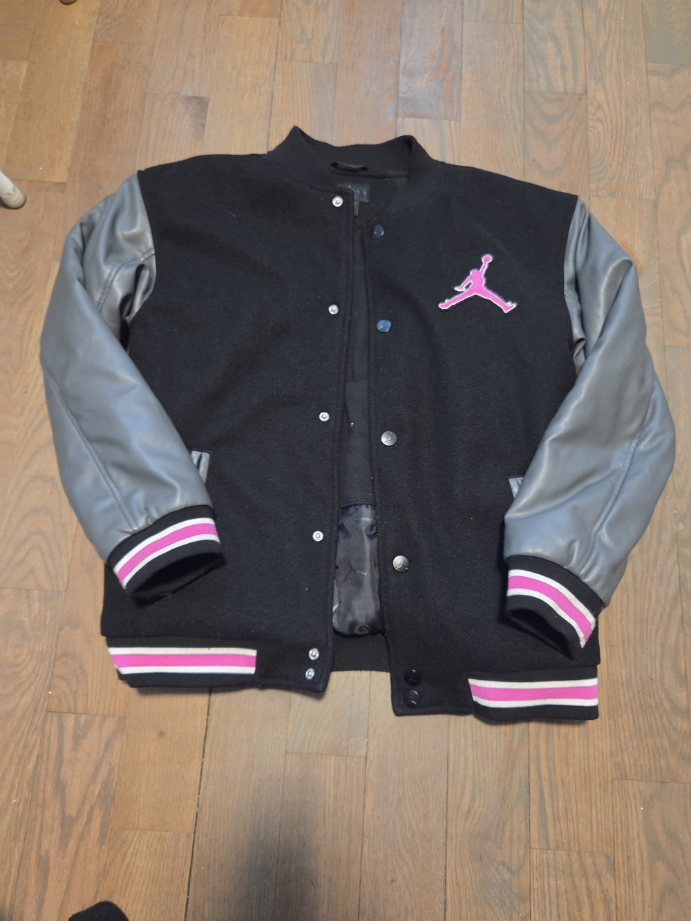 Jordan Black Varsity Jacket with Gray Sleeves and Pink Logo